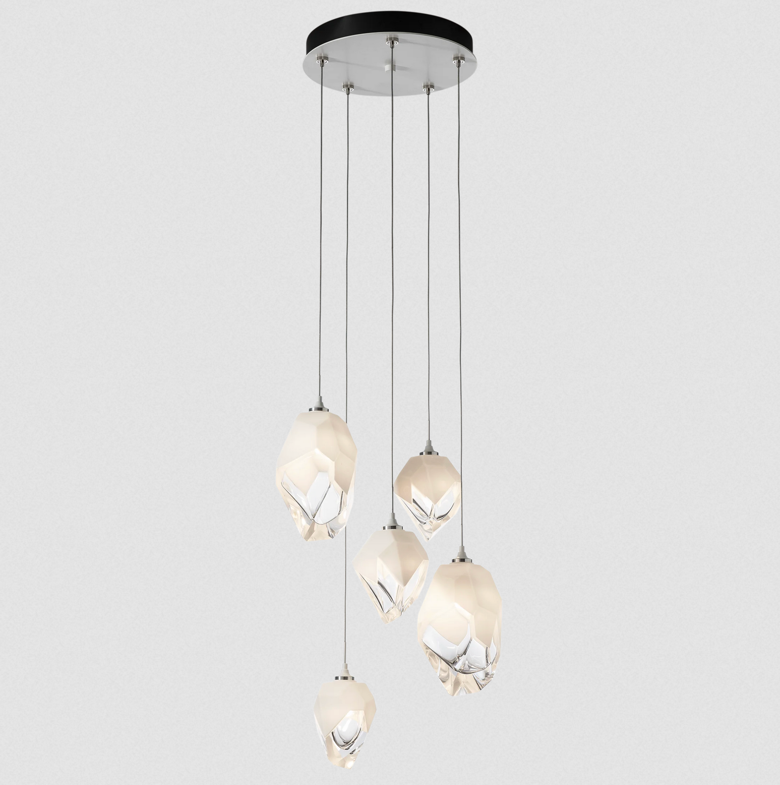 The Chrysalis 5-Light Mixed Crystal Pendant is a multi-port fixture that features five (2 large + 3 small), handcrafted faceted blown glass elements suspended from a round canopy.