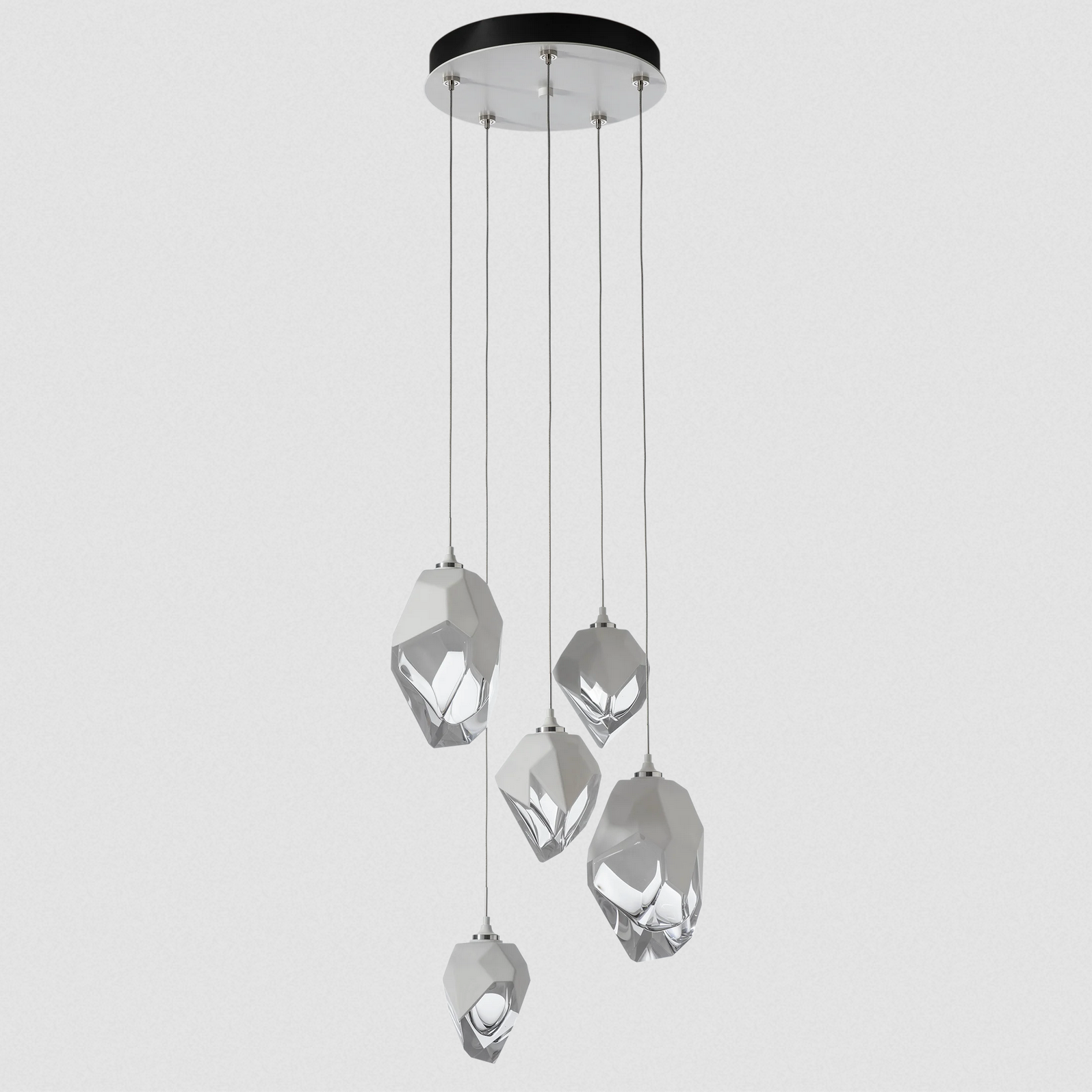 The Chrysalis 5-Light Mixed Crystal Pendant is a multi-port fixture that features five (2 large + 3 small), handcrafted faceted blown glass elements suspended from a round canopy.