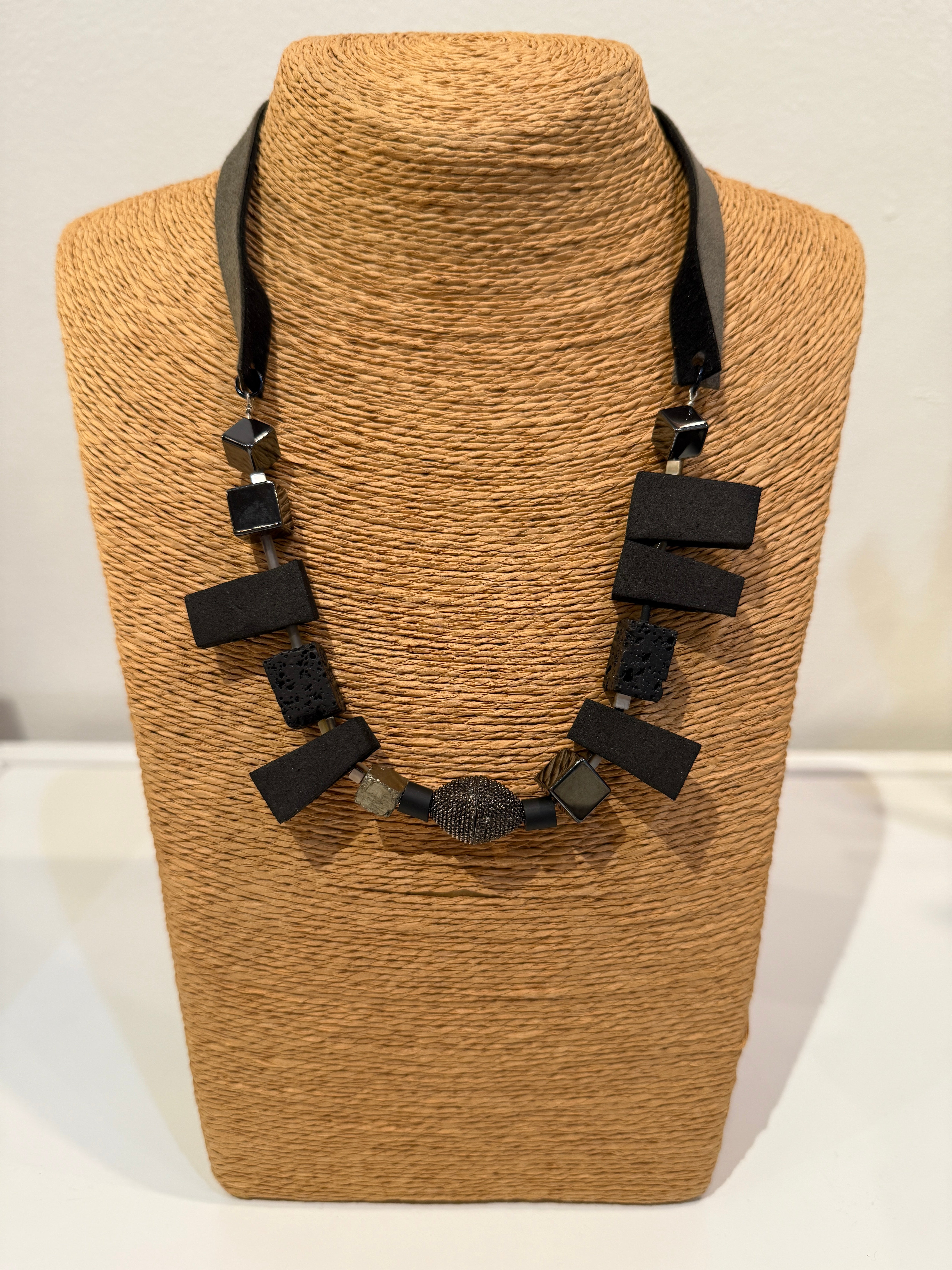 Lava, hematite, rubber and magnetite necklace with magnetic decorative clasp with suede straps dual tone straps