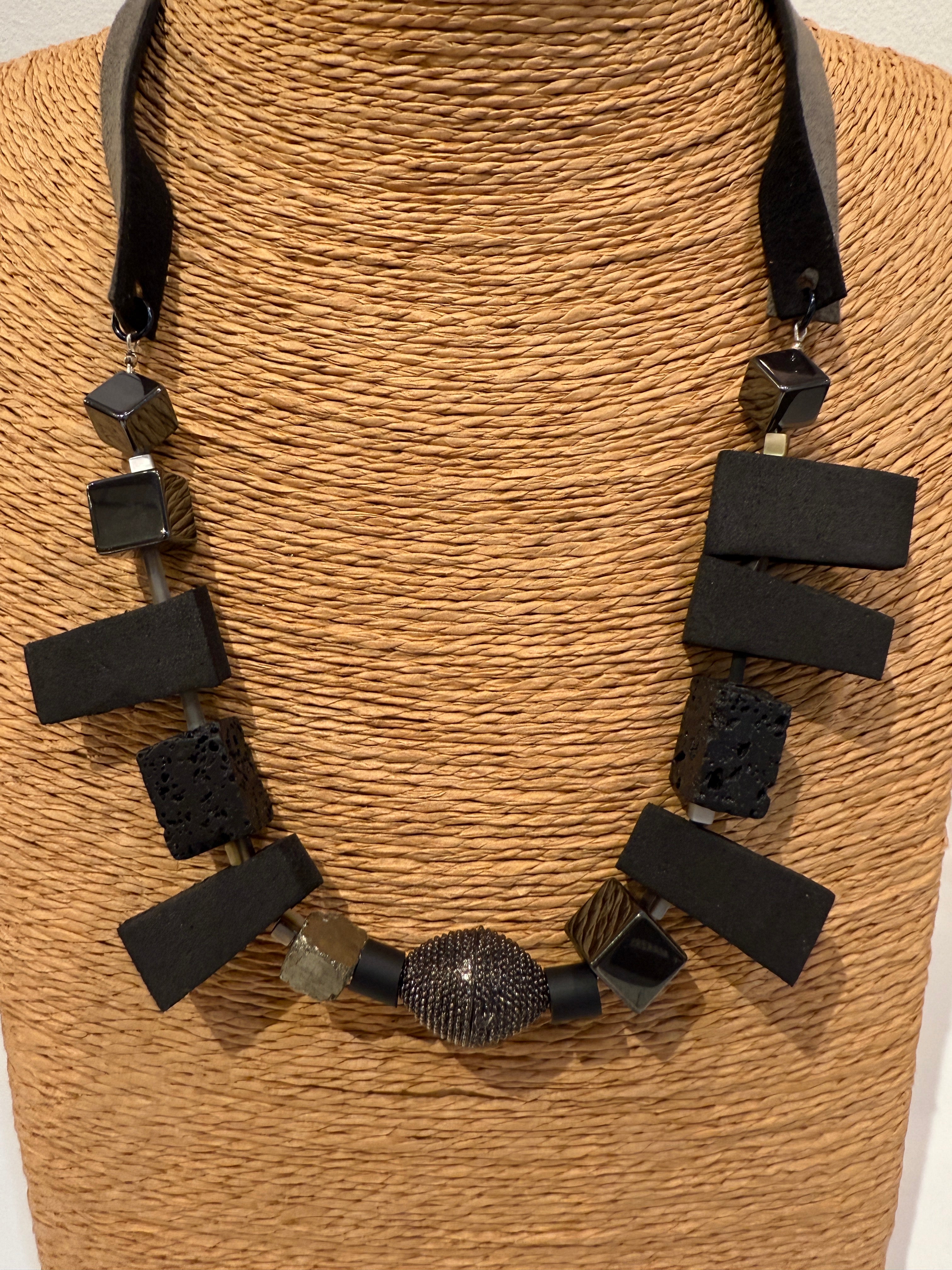 Lava, hematite, rubber and magnetite necklace with magnetic decorative clasp with suede straps dual tone straps