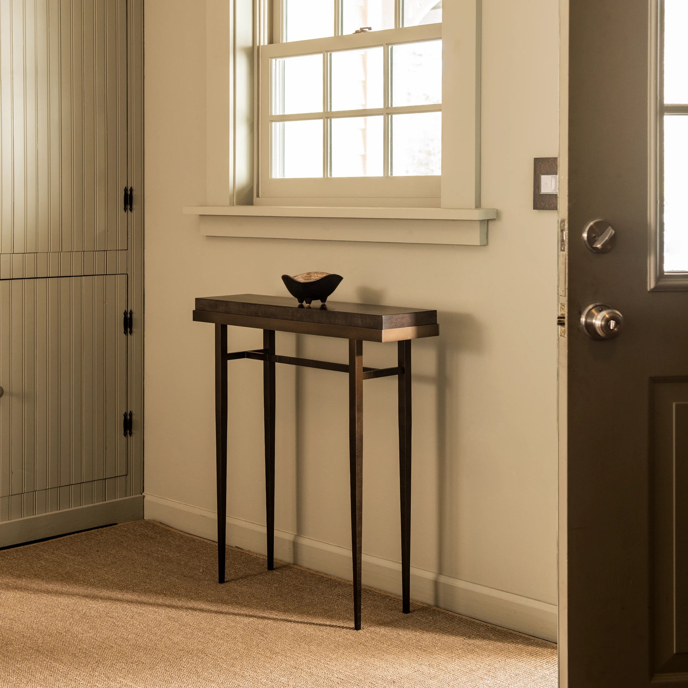 The smallest console table in the Wick Collection, the Wick 30" Console features a 1.5" thick, solid Vermont maple wood top. The maple wood top fits securely, filling the console's narrow steel frame from edge-to-edge. 