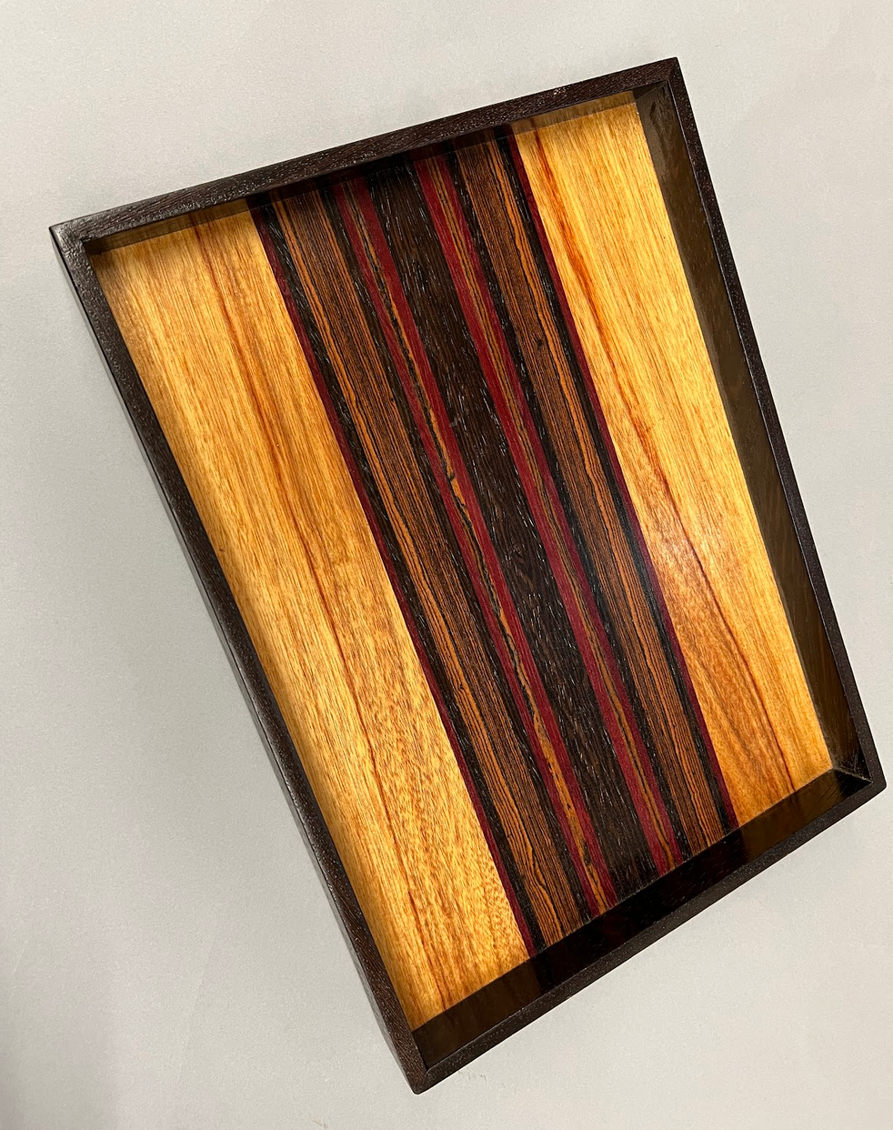 Canarywood, Purpleheart, Bocote and Wenge tray. Finsihed with Shallac - avoid alcohol and standing water.