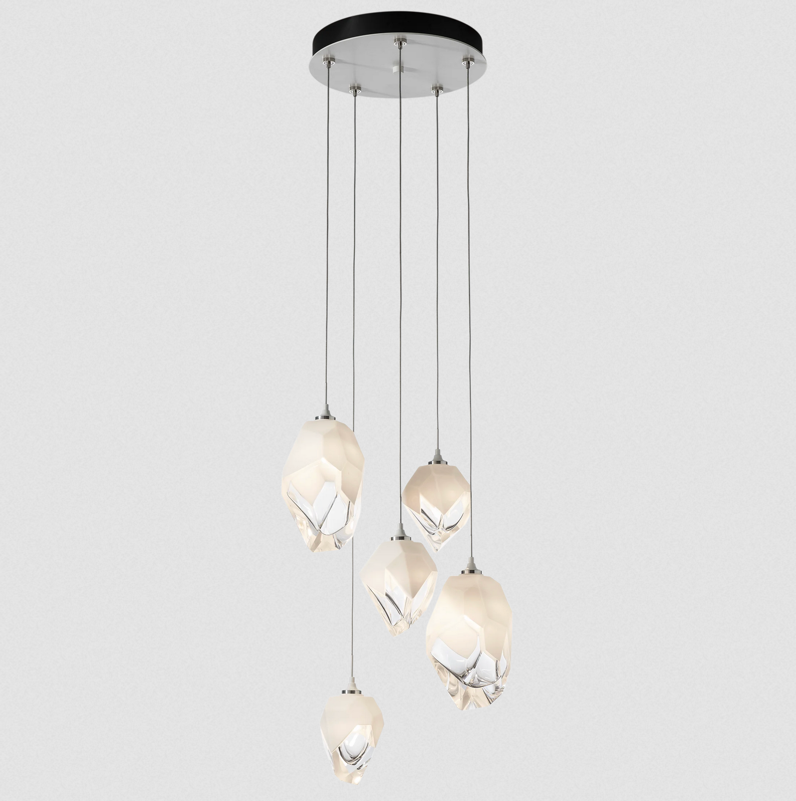 The Chrysalis 5-Light Mixed Crystal Pendant is a multi-port fixture that features five (2 large + 3 small), handcrafted faceted blown glass elements suspended from a round canopy. 