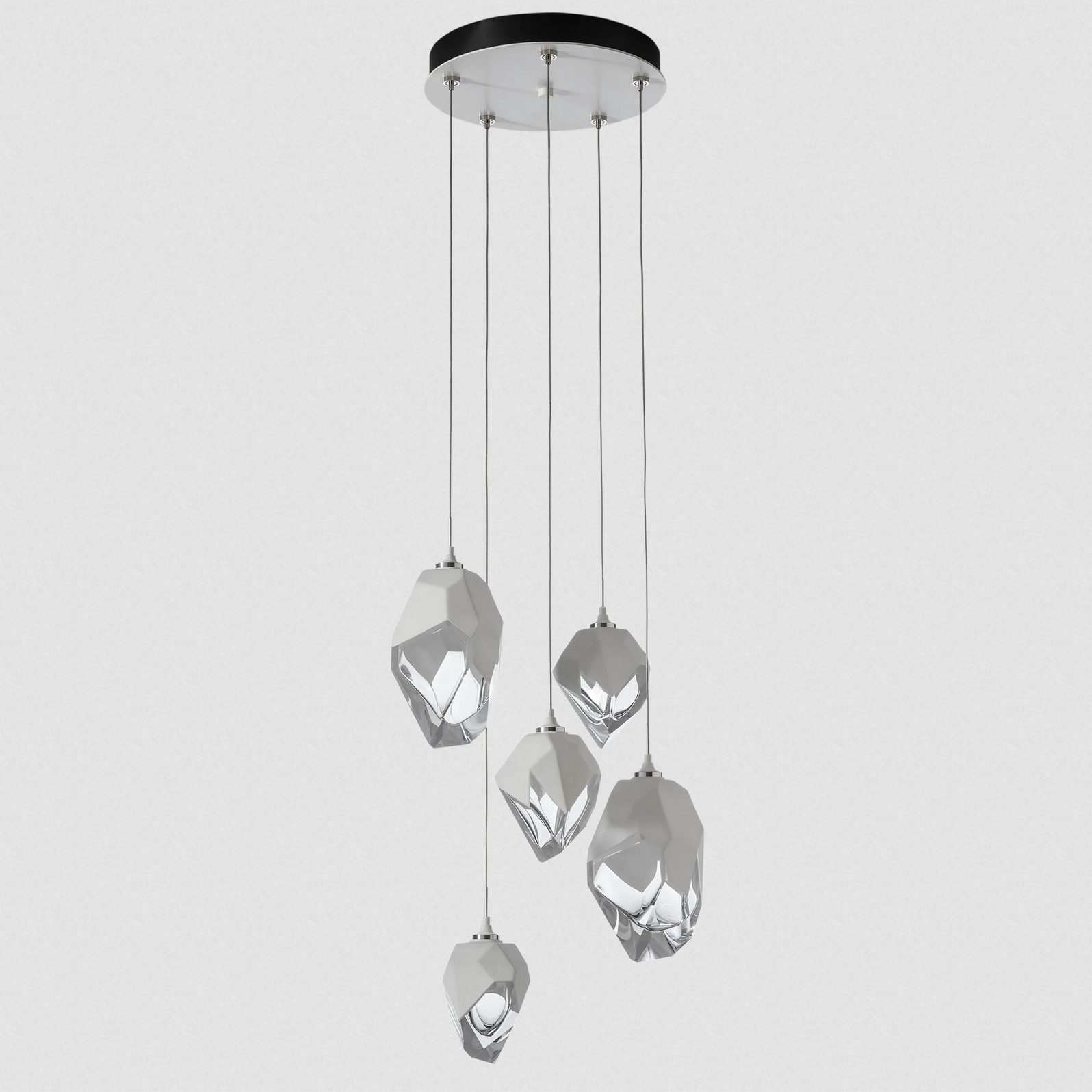 The Chrysalis 5-Light Mixed Crystal Pendant is a multi-port fixture that features five (2 large + 3 small), handcrafted faceted blown glass elements suspended from a round canopy. 