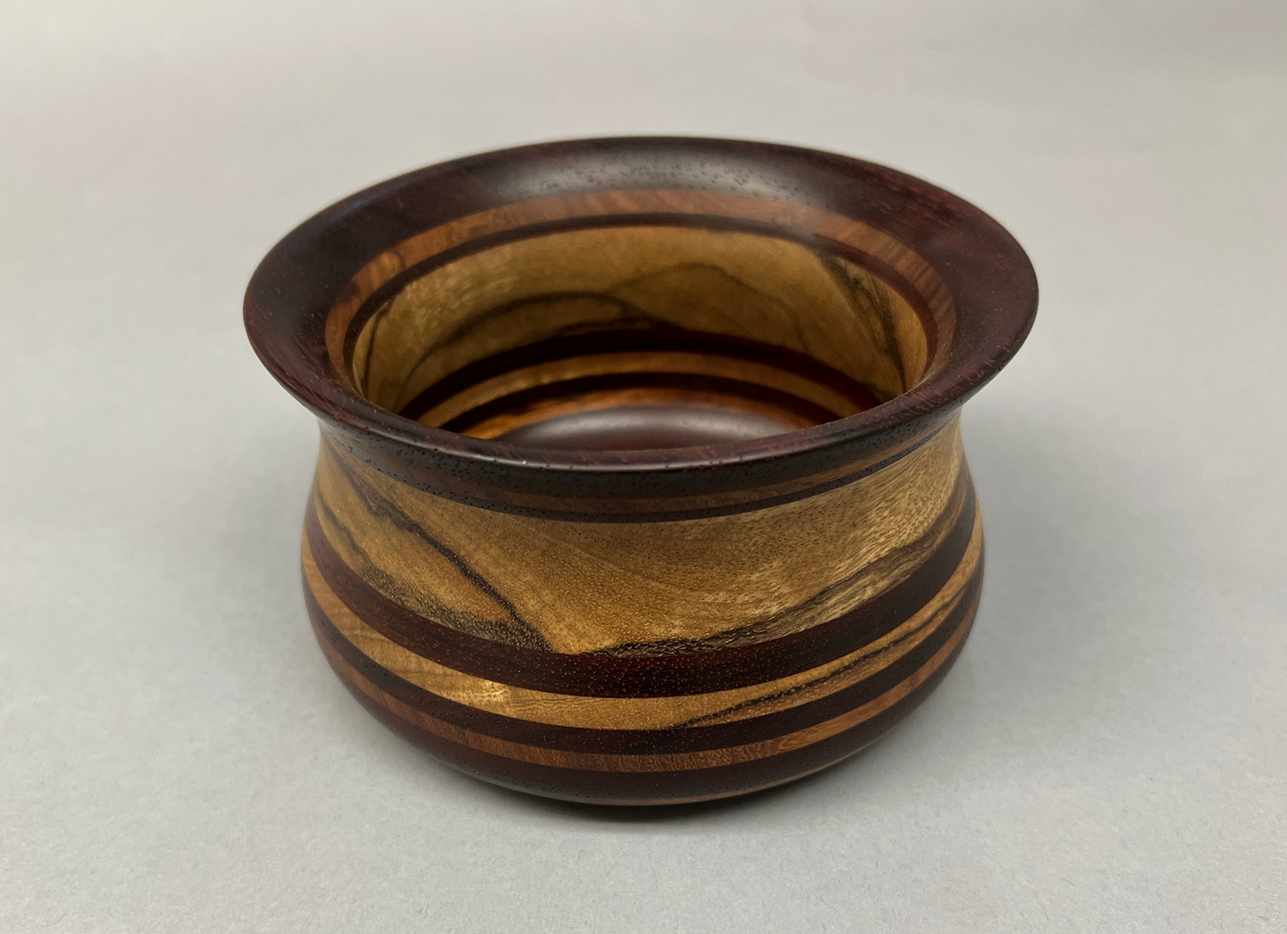 Aged Padauk and Black Limba wood bowl.