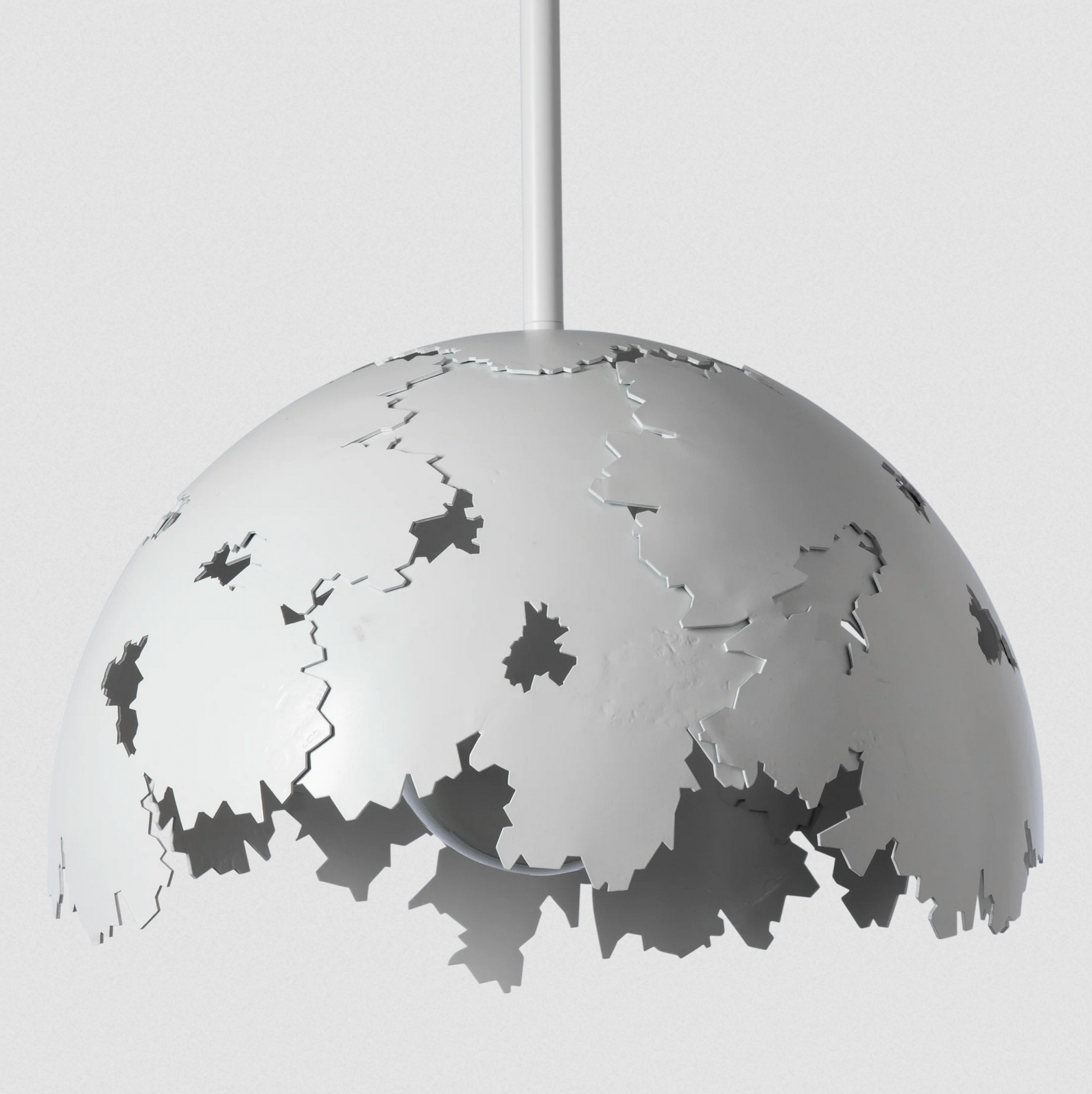 The Pangea 1-Light Pendant is "much like the tectonic plates that originally formed the supercontinent known as Pangea," according to Designer David Martin. "The forged plates collide and merge forming a unified whole.” A metal dome of forged steel creates a fusion of nature-inspired design and bold aesthetics, making a statement in any space.