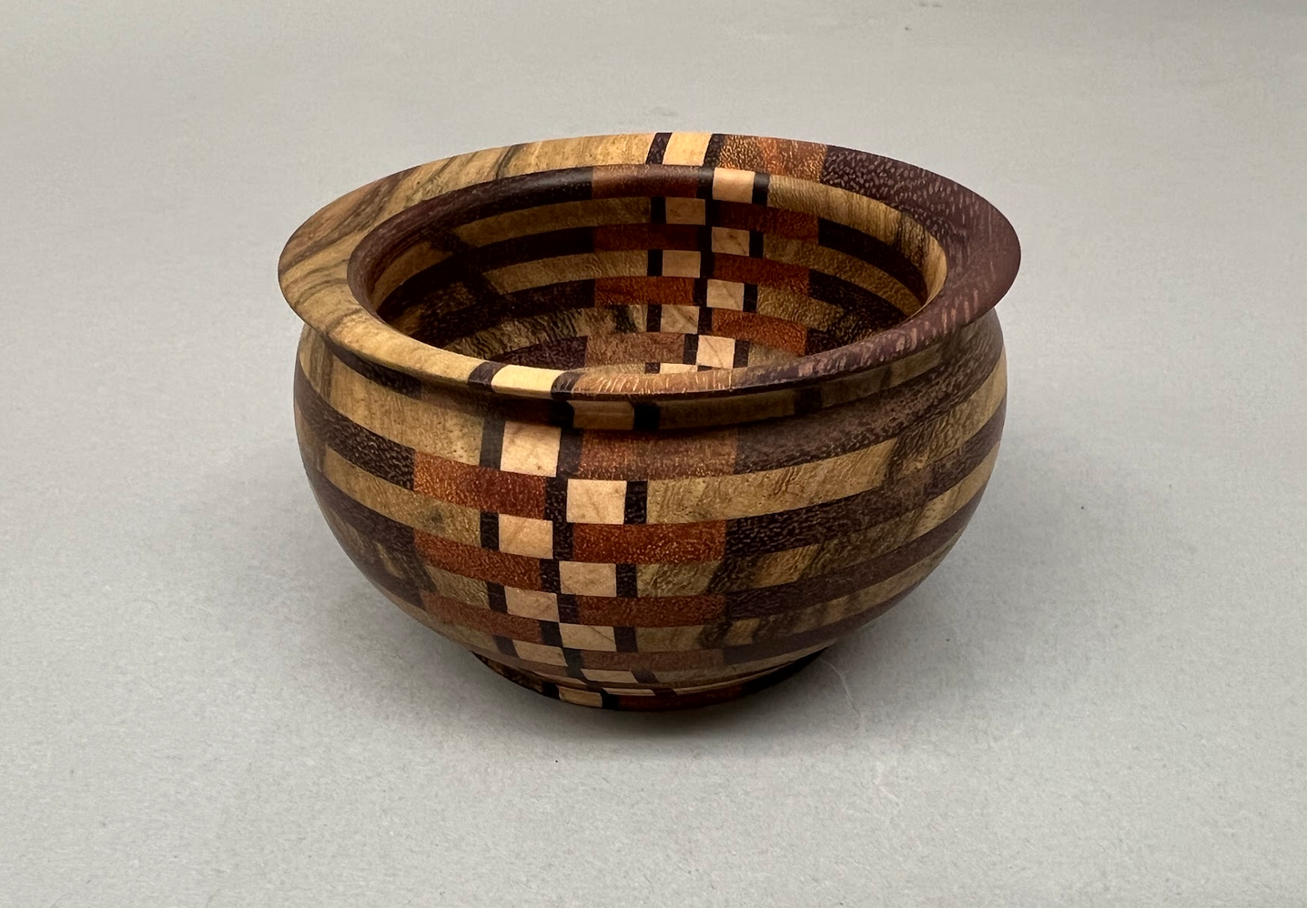 Purpleheart, Black Limba, Maple and Goncalo Alves wood bowl. Finished with Tung oil - food safe.