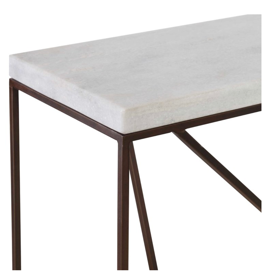 Perfect imperfection and clean design combine to create a stylish console that is a solution for halls and smaller spaces. A well-balanced and seemingly random designed base is clean and modern while still having character. Made of steel in aged black with a honed white marble top.