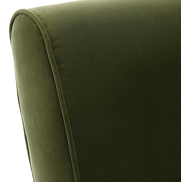 Bold mid-century style is elevated with the dramatic back of the Knoll Accent Chair. Crafted from stainless steel in brushed brass with button accents. Upholstered in a smooth olive green polyester velvet. Fabric is 100% polyester.